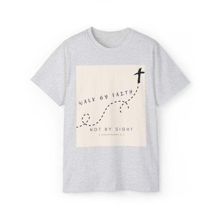 May include: A gray t-shirt with a white rectangle on the front. The rectangle has black text that reads 'Walk by faith, not by sight' and a black cross with a dotted line leading to it. The text '2 Corinthians 5:7' is also included in the rectangle.