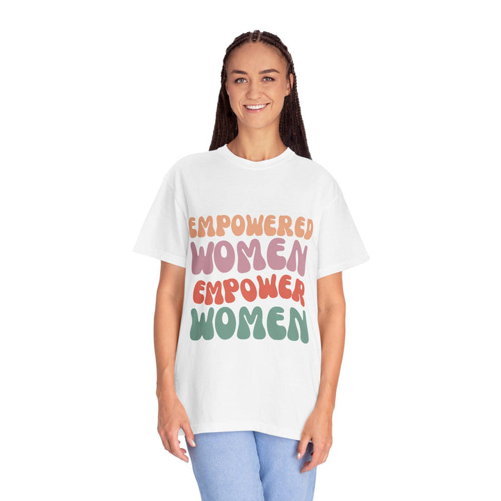 May include: A white t-shirt with the text 'EMPOWERED WOMEN EMPOWER WOMEN' in colorful, stylized lettering.